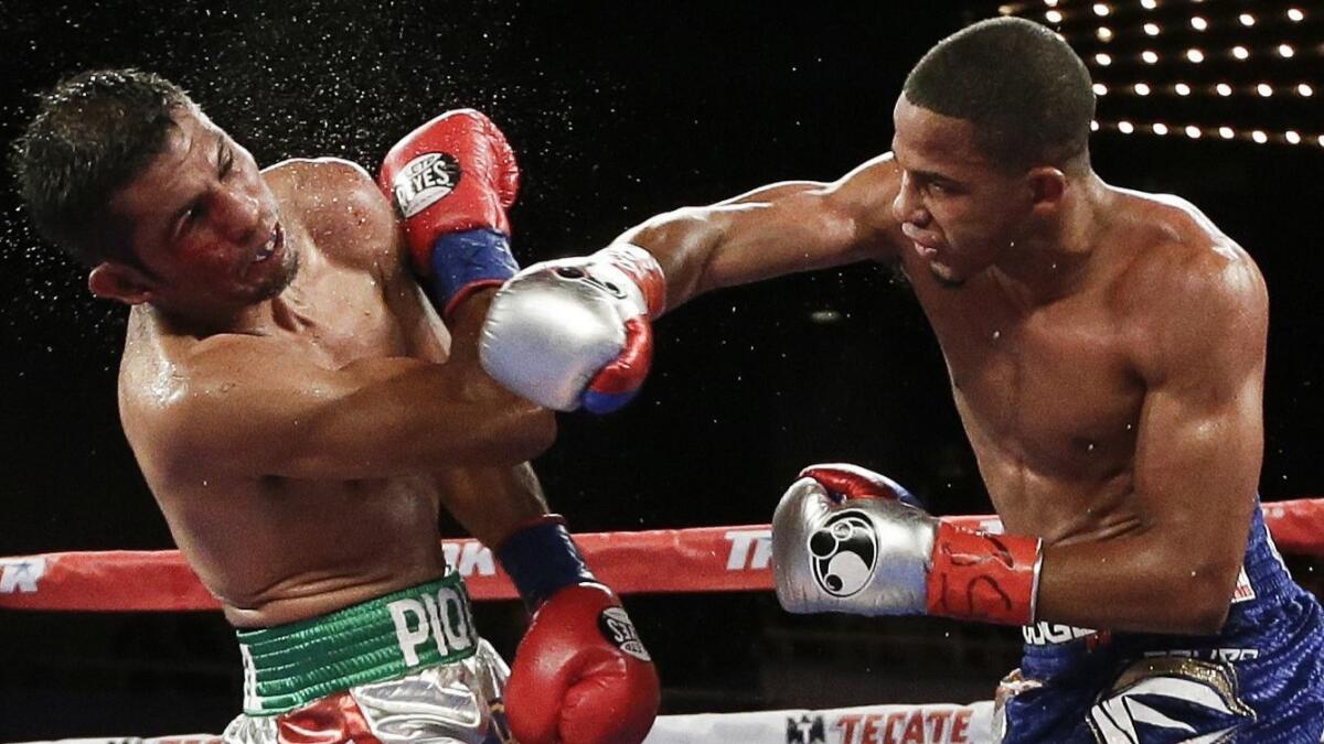 Felix Verdejo, right, battles Juan Jose Martinez during the fifth round of a WBO lightweight title bout in June 2016.