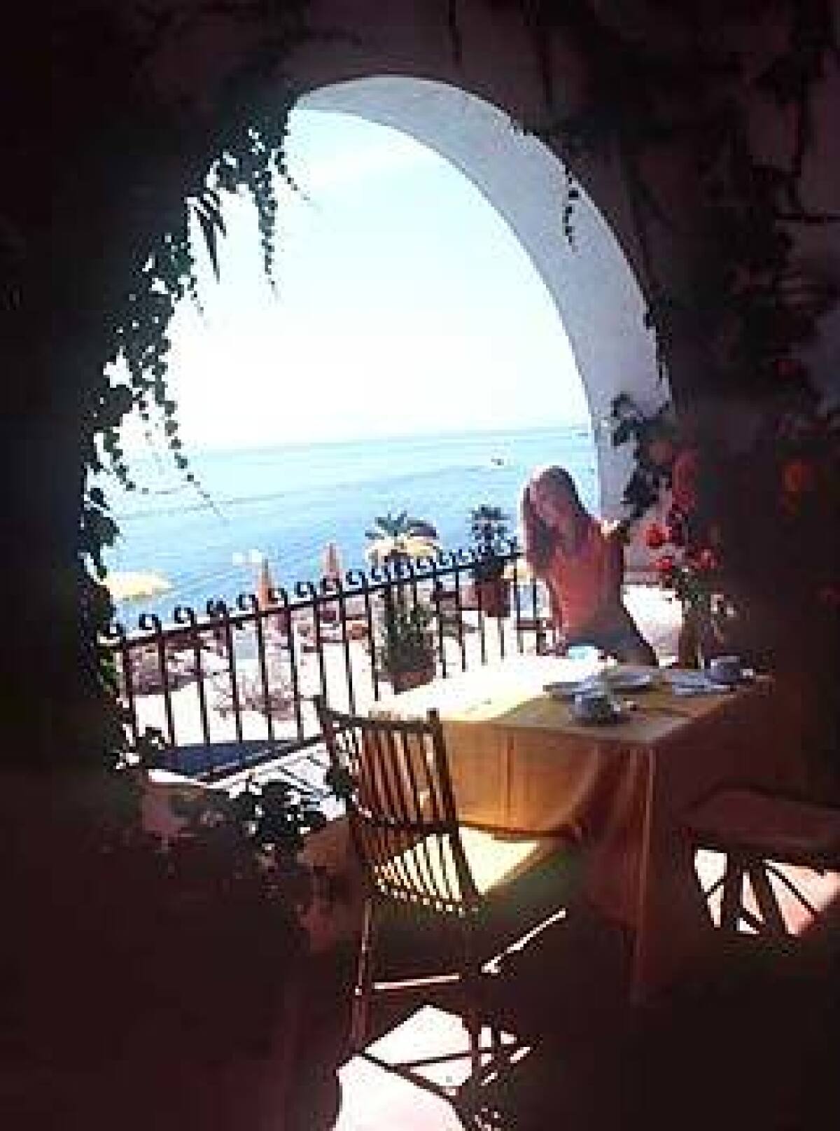 Enjoy your morning coffee  and the view  from an ocean-facing balcony at Liparis Hotel Carasco.