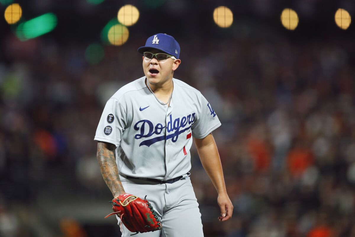 Los Angeles Dodgers pitcher Julio Urias reacts during the second inning of Game 2 of a baseball National League Division Series against the San Francisco Giants Saturday, Oct. 9, 2021, in San Francisco. (AP Photo/John Hefti)