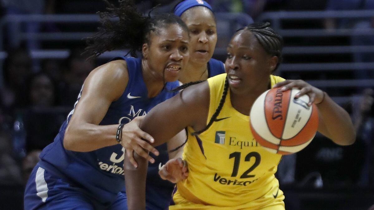 Sparks guard Chelsea Gray tries to work through the Minnesota Lynx defense in the fourth quarter of an WNBA playoff game at Staples Center on Tuesday.