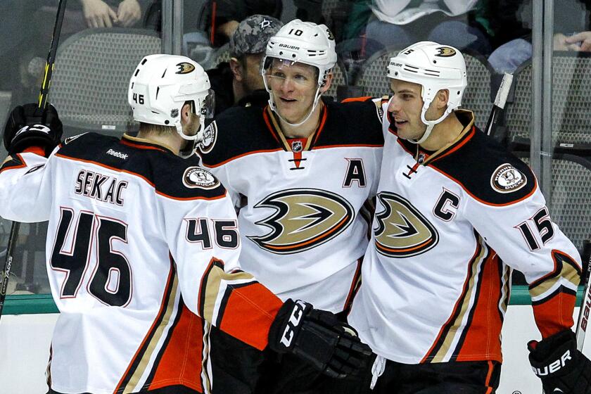 Ducks right wing Corey Perry (center) is congratulated by teammates Jiri Sekac and Ryan Getzlaf (15) after scoring against the Star in the first period Sunday in Dallas.