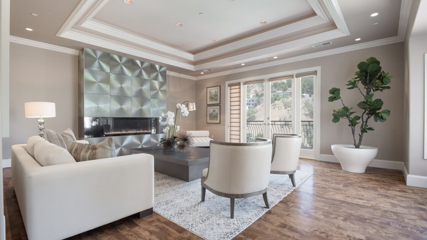 The roughly 5,900-square-foot home in Studio City was recently remodeled and features chrome accents, vibrant textiles and subdued hues, and an elevator.