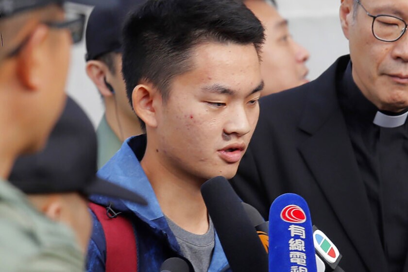 Suspect Chan Tong-kai fields questions after being released from prison Wednesday.