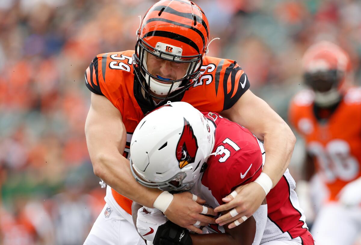 Cincinnati Bengals linebacker Nick Vigil tackles David Johnson of the Arizona Cardinals during their game in October. 