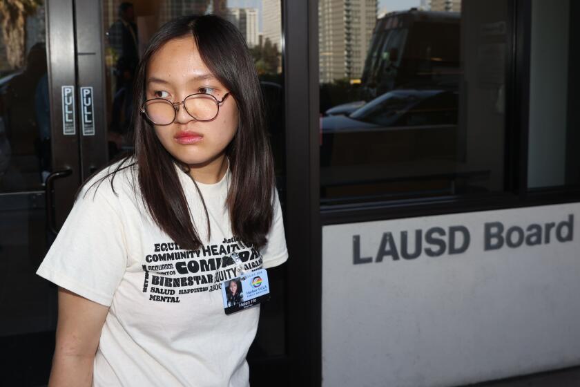 Los Angeles, CA - June 18: Helen Ho, a high school junior, prepare to walk into the conference room to speak to LAUSD council members while showing support of Stop LAPD Spying at LAUSD Headquarters on Tuesday, June 18, 2024 in Los Angeles, CA. (Michael Blackshire / Los Angeles Times)