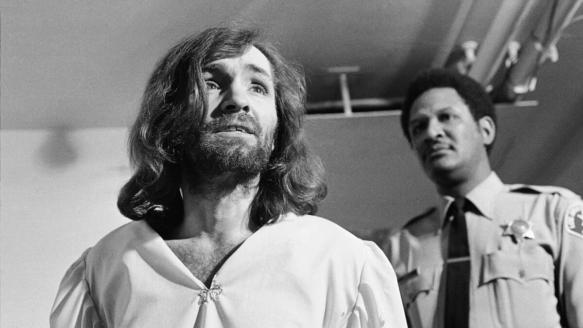 Charles Manson is seen leaving court in Los Angeles on March 19, 1970.