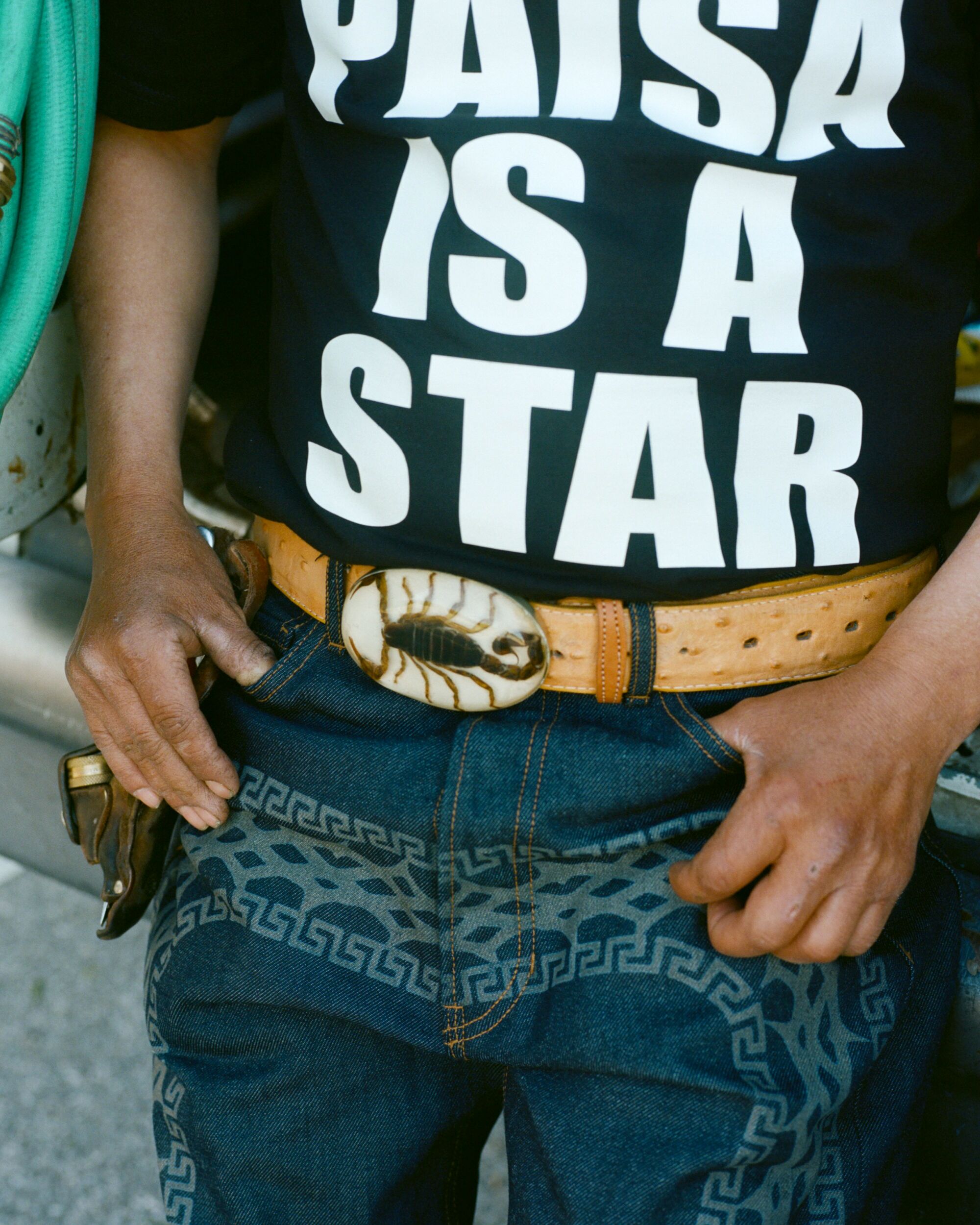 Landscaper wears Paisaboys Charro/Psycho denim, Paisaboys “EVERY PAISA IS A STAR” shirt and Paisaboys Cachucha de Jardinero.