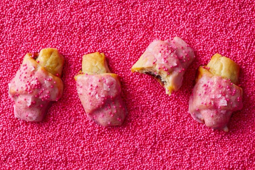 Rosewater and olive oil infuse dates in these flaky rugelach, glazed in vibrant pink icing and sprinkled with sea salt.