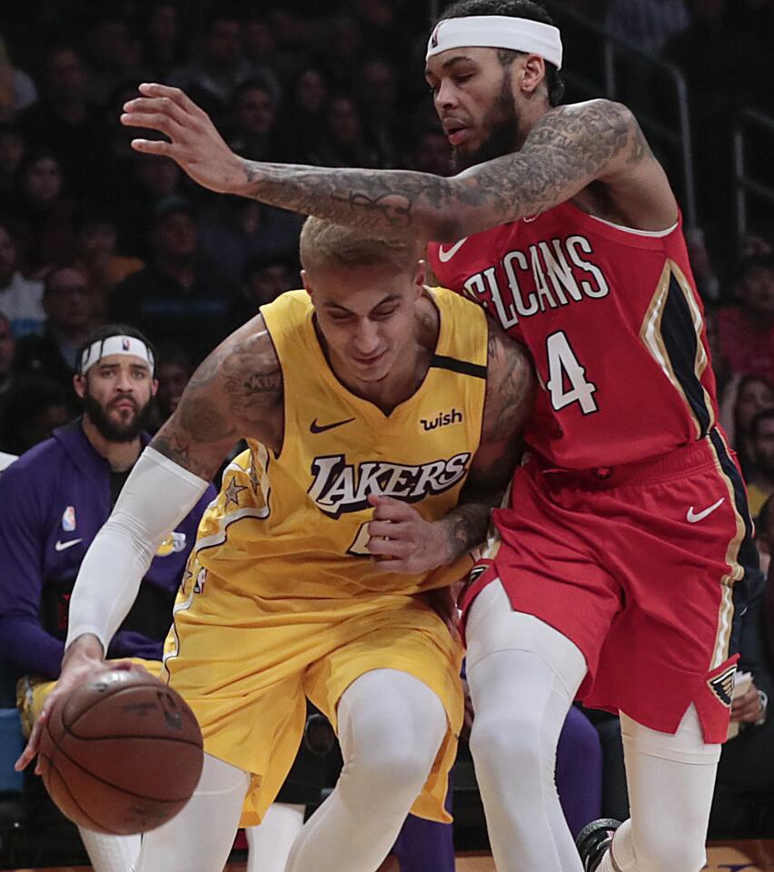 Lakers forward Kyle Kuzma tries to drive past Pelicans forward Brandon Ingram in the second quarter. Kuzma scored 10 points off the bench.