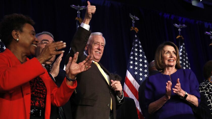 House Democratic leader Nancy Pelosi (D-San Francisco) applauds as Rep. Steny Hoyer (D-Md.) gives a thumbs-up during an election-night celebration at the Hyatt Regency Hotel in Washington on Tuesday.