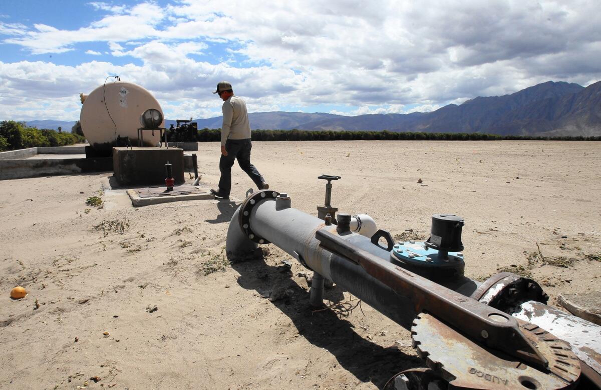 A pipeline carries pumped water serving the Borrego Valley, where years of overdrafting has caused the water table to drop by as much as 119 feet in some areas, with a 26-foot decline in the last decade.