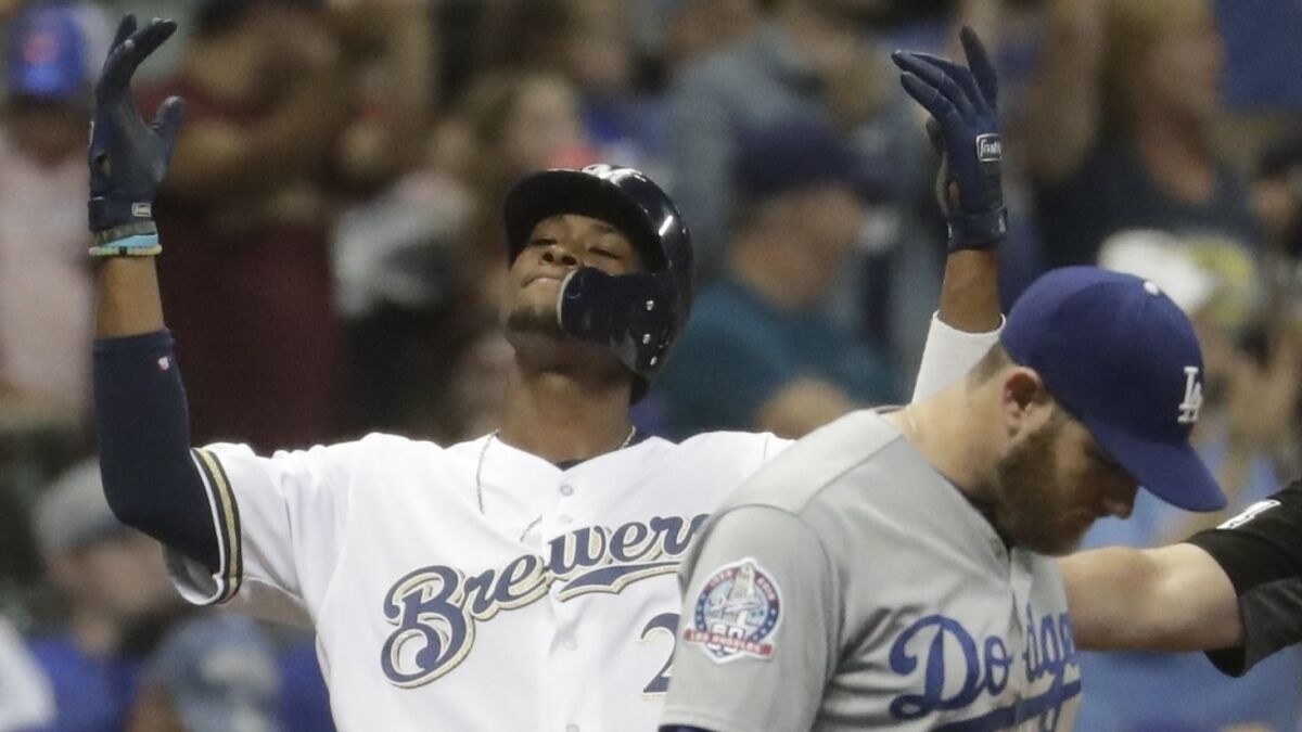 Milwaukee Brewers' Keon Broxton reacts after hitting an RBI triple during the sixth inning against the Dodgers on July 21 in Milwaukee.