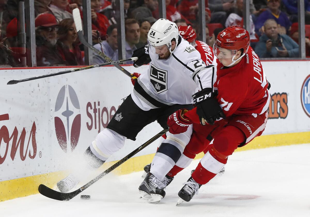 Red Wings center Dylan Larkin (71) knocks Kings defenseman Derek Forbort (24) off the puck during the second period Thursday.