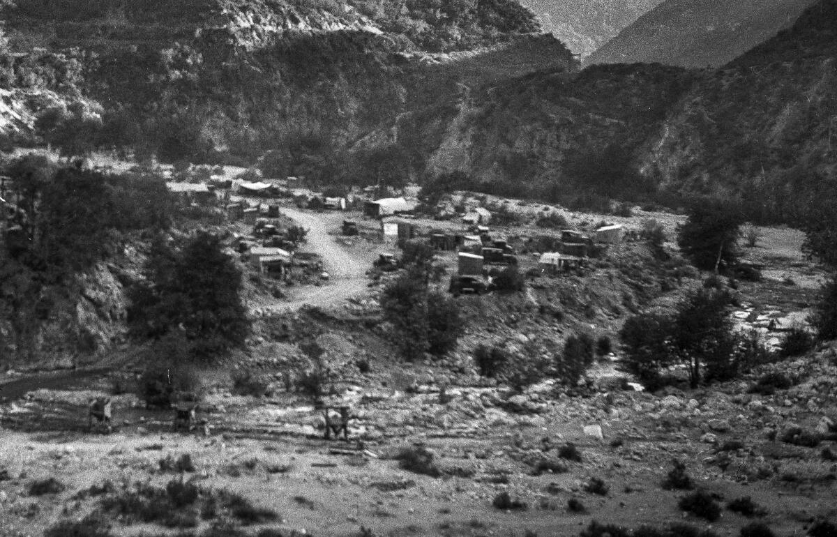 Shown is a view from above of the Lower Klondike gold mining camp in San Gabriel Canyon. 
