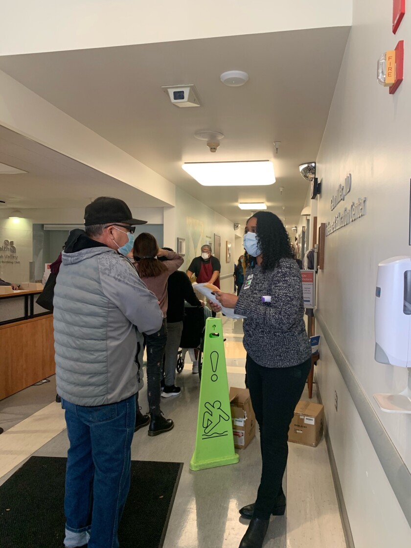 Residents in Ukiah line up for a COVID-19 vaccine after a freezer storing it broke.