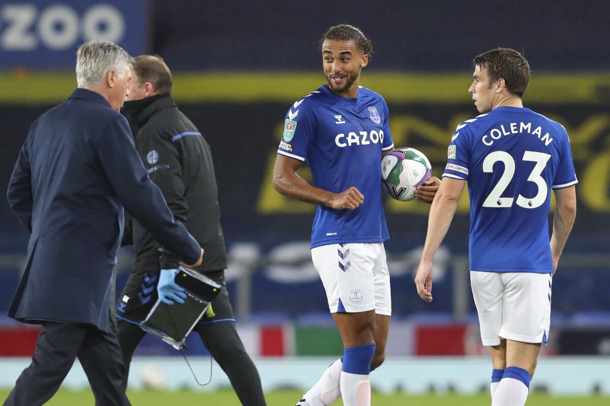 Everton's Dominic Calvert-Lewin holds the ball at the end of the English League Cup round of 16 soccer match between Everton and West Ham at the Goodison Park stadium in Liverpool, England, Wednesday, Sept. 30, 2020. (Alex Livesey, Pool via AP)