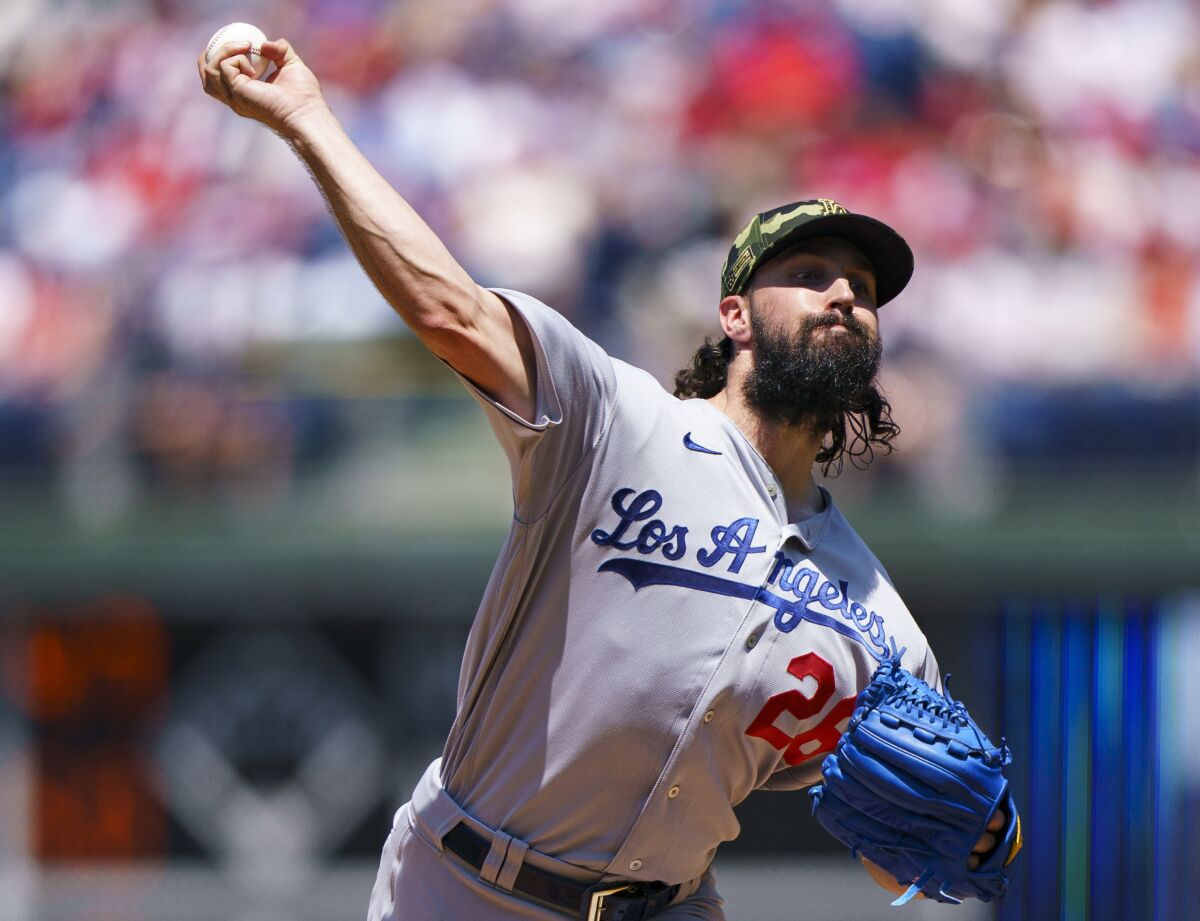 Los Angeles Dodgers starting pitcher Tony Gonsolin throws during the first inning of a baseball game.