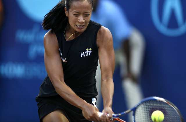 The Newport Beach Breakers' Anne Keothavong returns a forehand against the New York Sportimes' Martina Hingis during a World Team Tennis match.