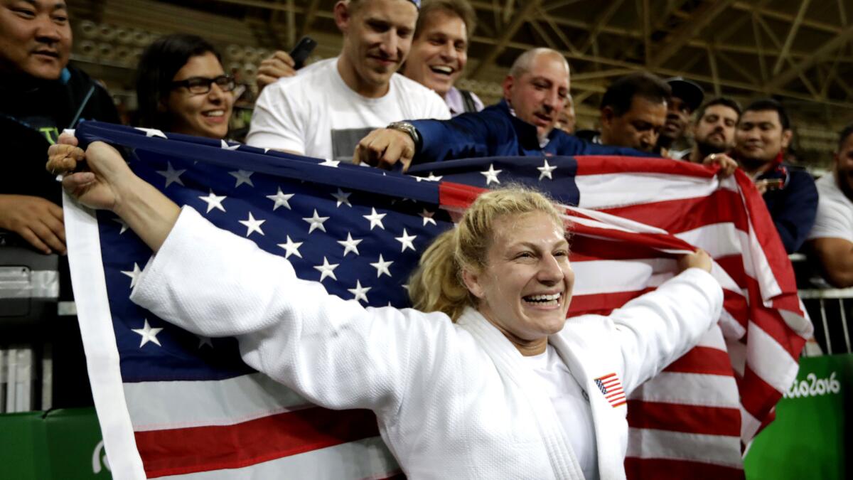 Kayla Harrison celebrates Thursday after repeating as Olympic champion in judo.