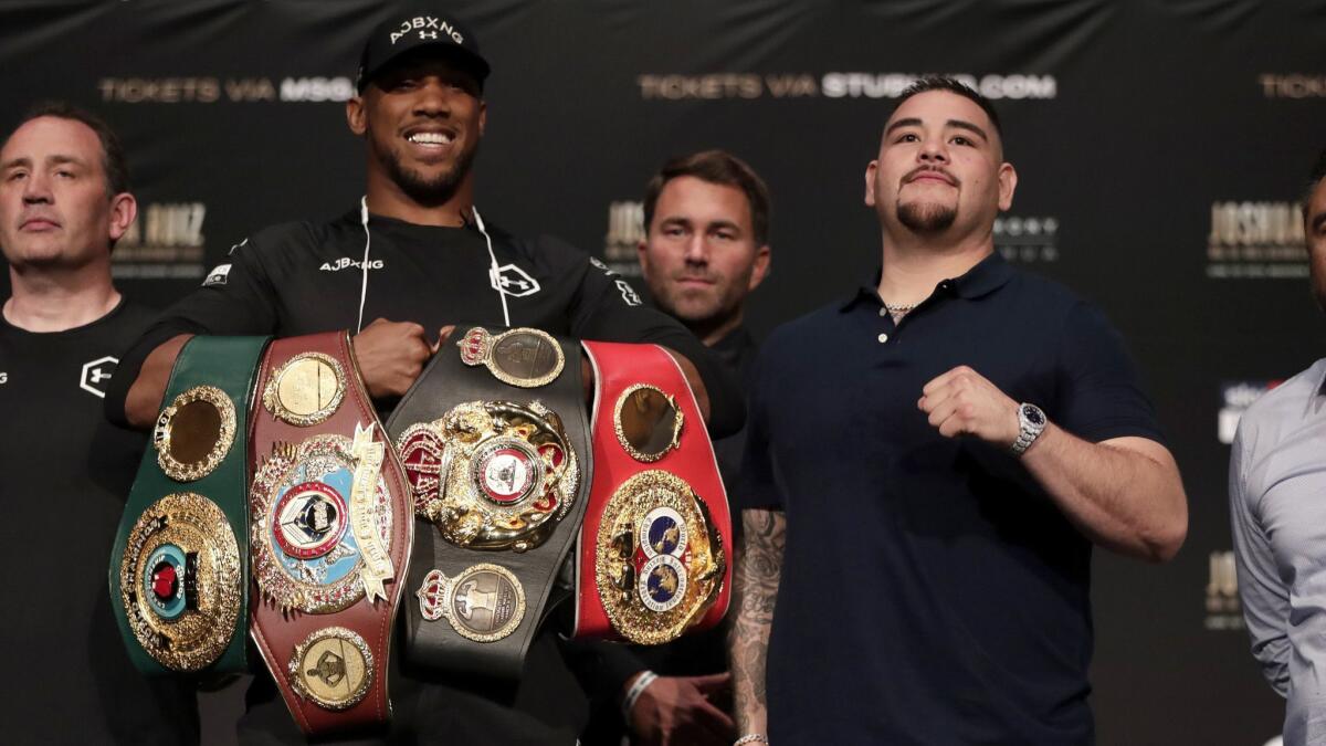 Anthony Joshua, left, and Andy Ruiz are shown at a news conference Thursday ahead of their heavyweight bout in New York. Joshua will defend his WBA, WBO and IBF heavyweight titles on Saturday.