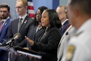 Fulton County District Attorney Fani Willis, center, speaks in the Fulton County Government Center during a news conference, Monday, Aug. 14, 2023, in Atlanta. Donald Trump and several allies have been indicted in Georgia over efforts to overturn his 2020 election loss in the state. (AP Photo/John Bazemore)