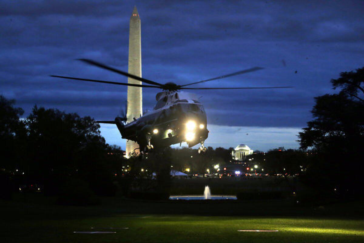 The Marine One helicopter carrying President Obama lands on the South Lawn of the White House after the president inspected the damage caused by super storm Sandy in New Jersey.