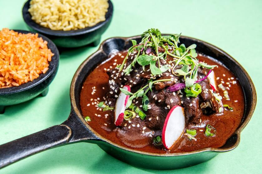 Garnish this mole with sesame seeds, fresh radishes and greens and serve with rice.