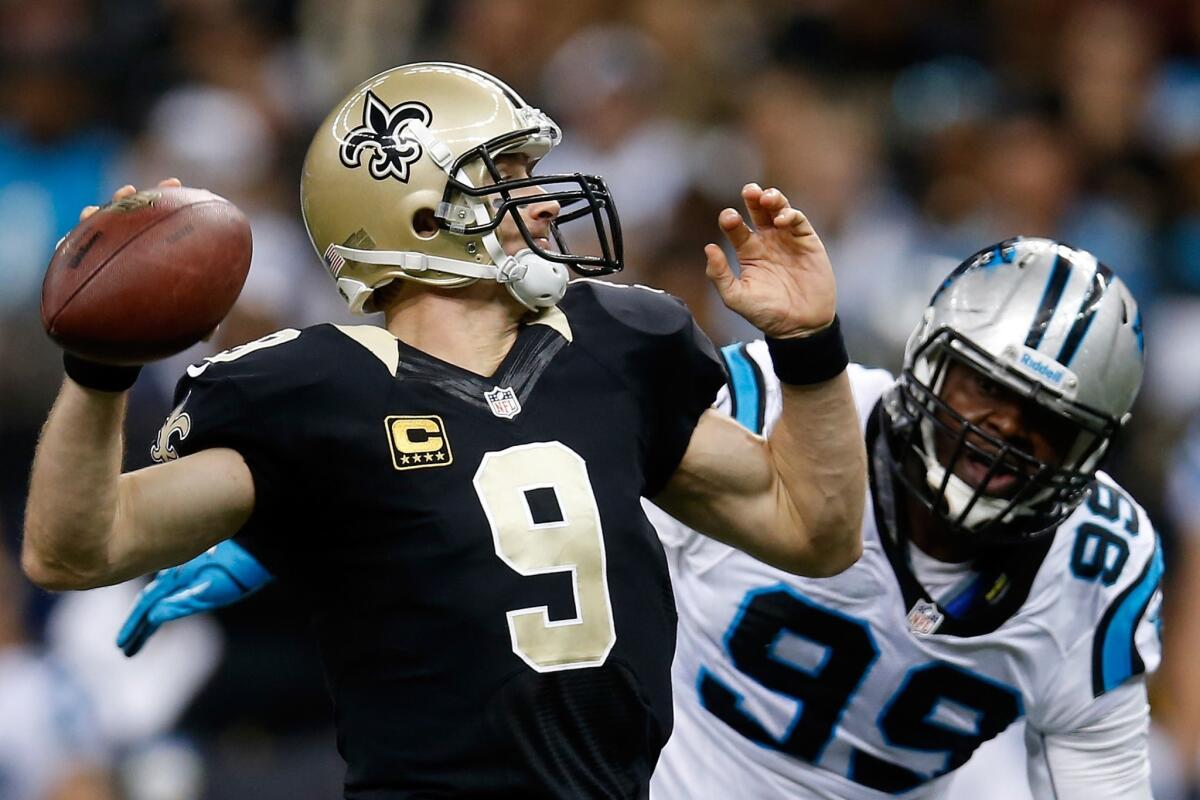New Orleans quarterback Drew Brees makes a pass during the Saints' 31-13 victory Sunday over the Carolina Panthers.