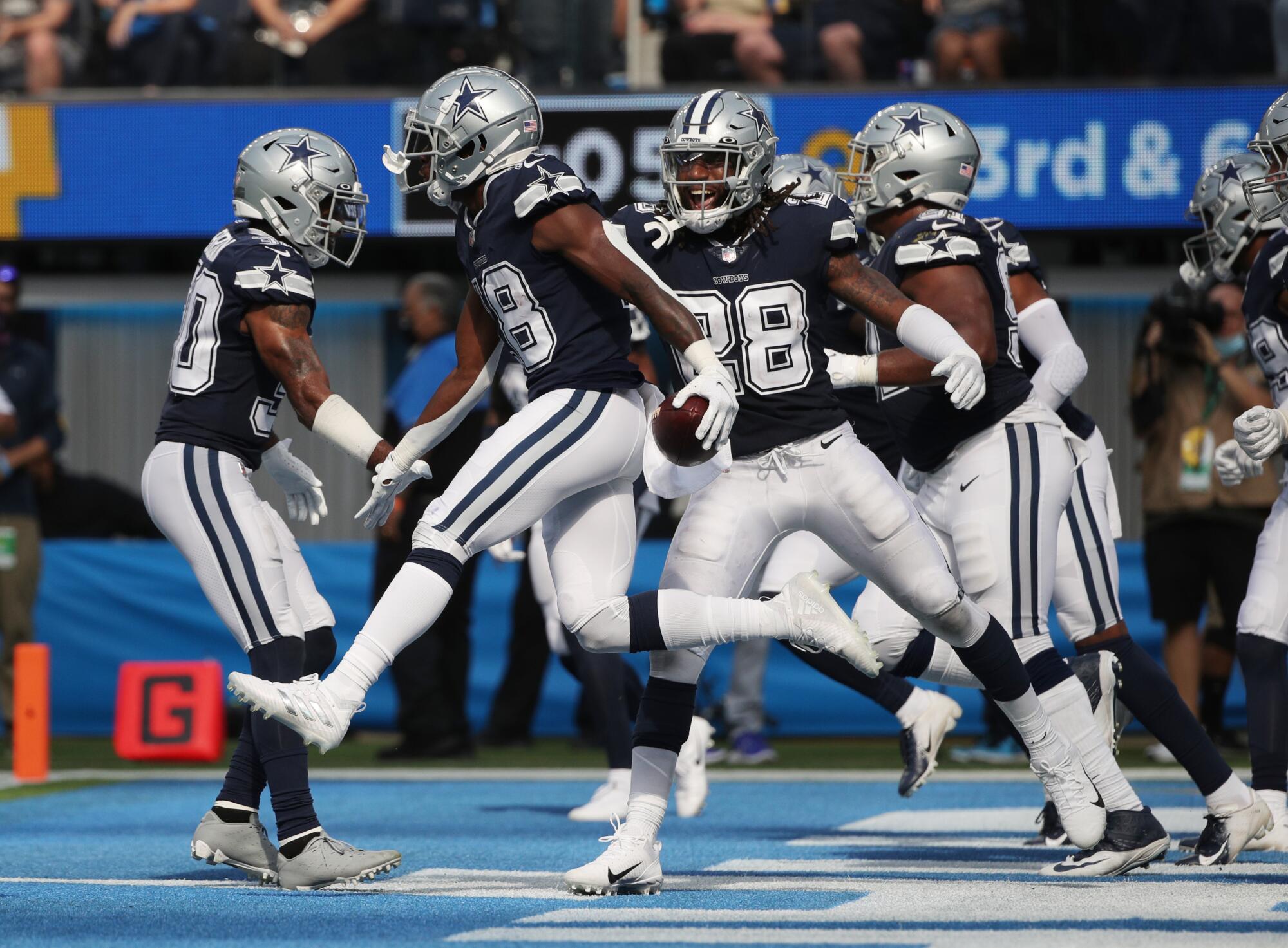 Dallas Cowboys strong safety Damontae Kazee (18) reacts with his teammates after intercepting a pass in the end zone