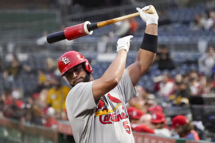 St. Louis Cardinals' Albert Pujols warms up in the on-deck circle before batting against the Pittsburgh Pirates during the first inning of a baseball game, Monday, Oct. 3, 2022, in Pittsburgh. (AP Photo/Keith Srakocic)