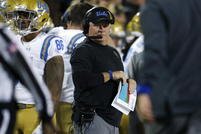 UCLA coach Chip Kelly watches during the first half of the team's NCAA college football game against Colorado.