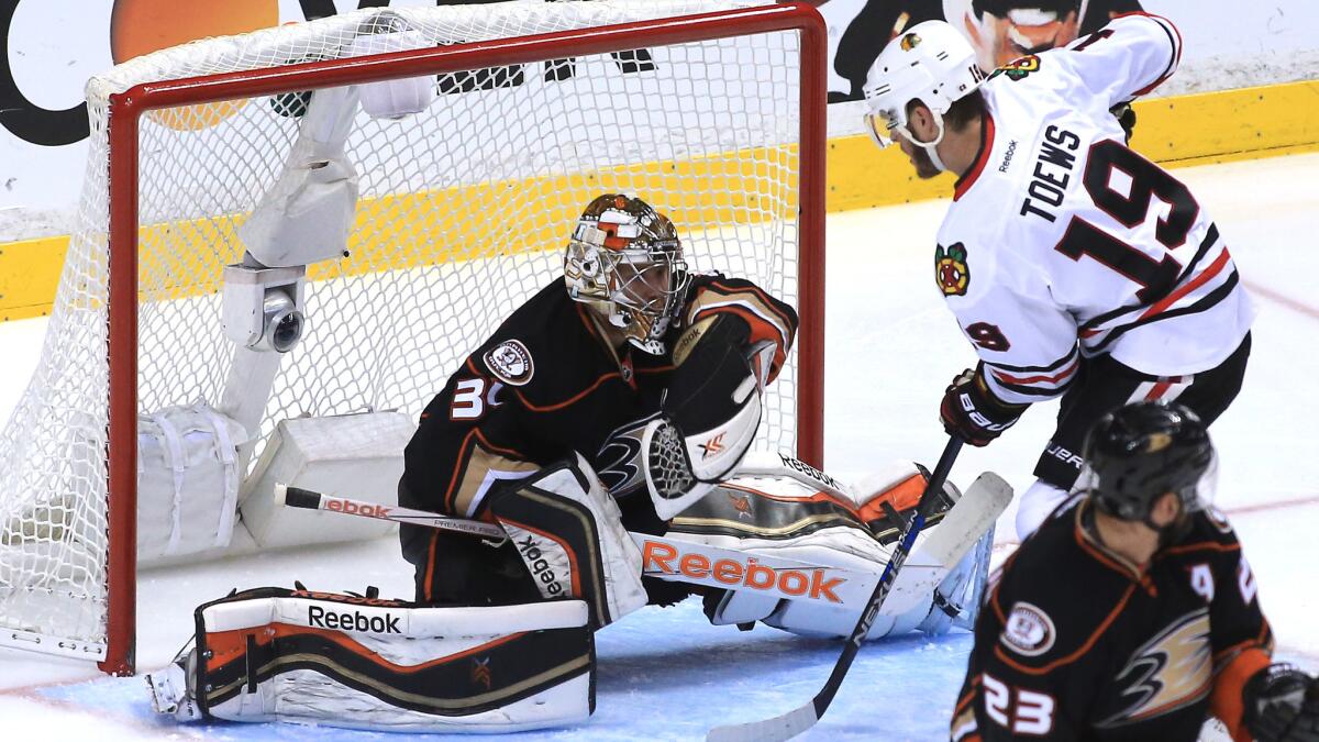 Ducks goalie Frederik Andersen makes a save on a shot by Chicago Blackhawks captain Jonathan Toews during the third period of Game 2 of the Western Conference finals at Honda Center on May 19, 2015.