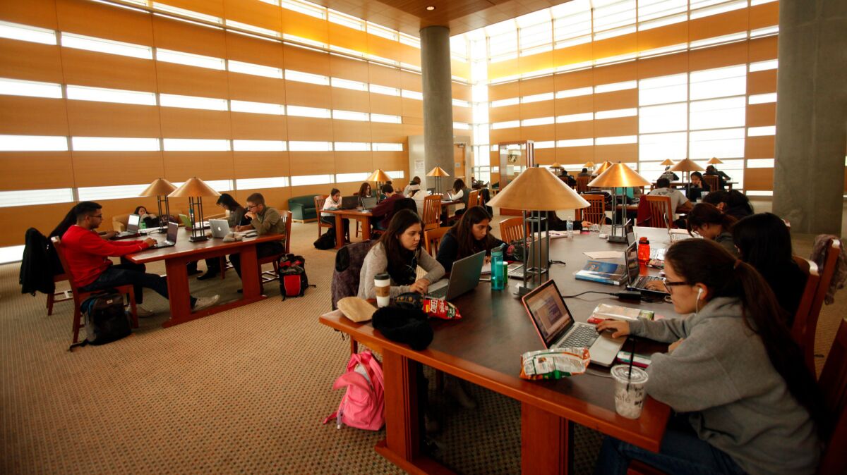 Students study inside the Kolligian Library at UC Merced, which made the list of best national universities for the first time in rankings announced Tuesday by U.S. News and World Report.