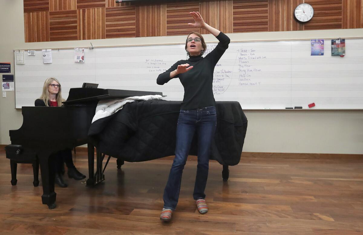 Orange Coast College conductor Eliza Rubenstein leads the chamber singers into next weekend's production of "El Mesías."