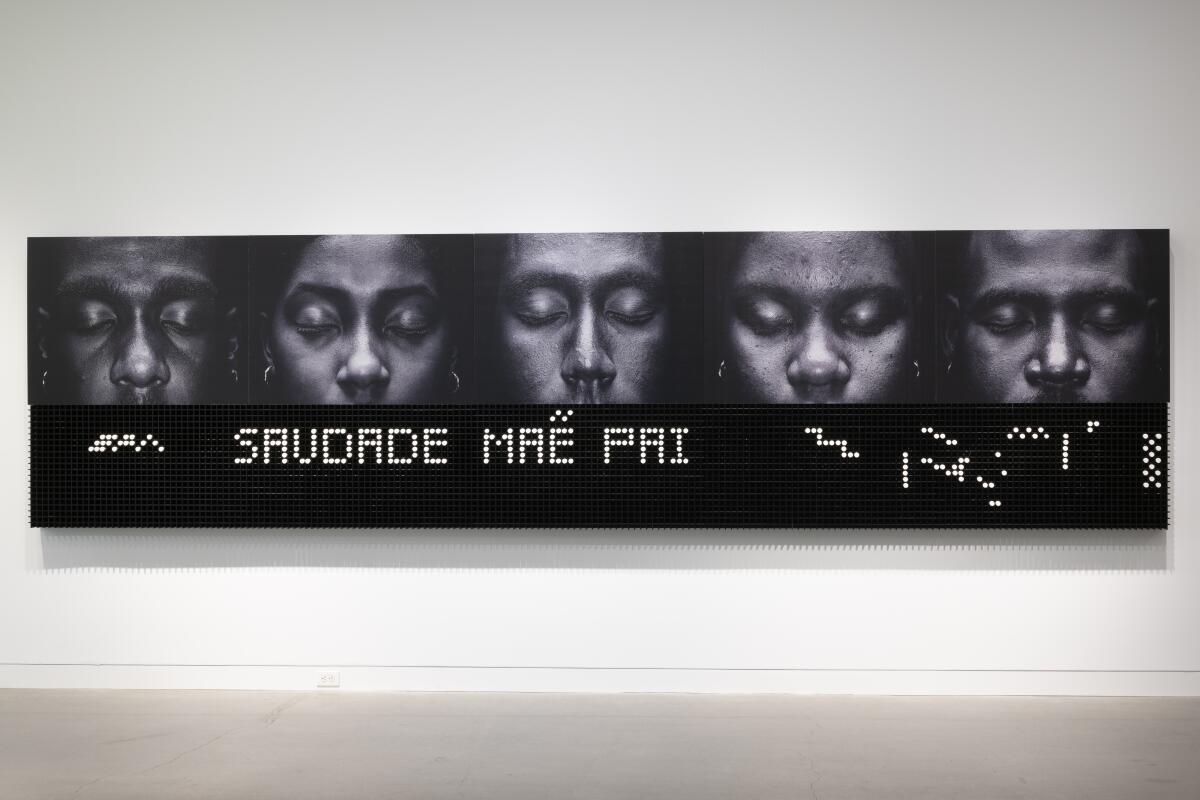An artwork shows close-cropped images of five people over a grid that spells out the phrase "Saudade mae pai"