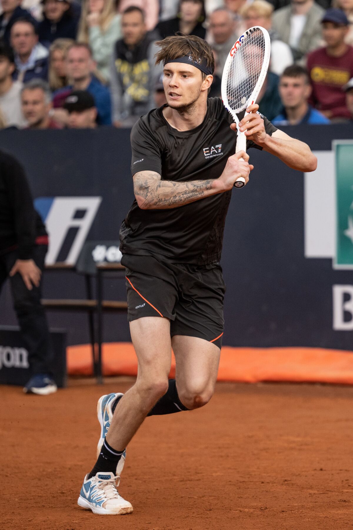 Alexander Bublik gets ready for a backhand return.