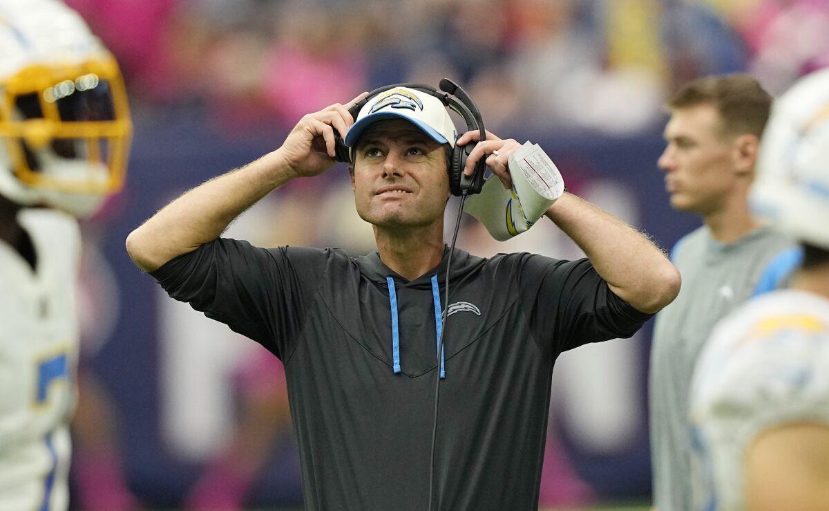 Los Angeles Chargers head coach Brandon Staley watches from the sidelines during the first half of an NFL football game against the Houston Texans, Sunday, Oct. 2, 2022, in Houston. (AP Photo/David J. Phillip)