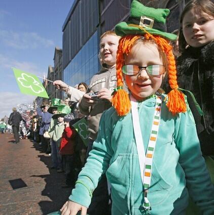 People attend St. Patrick's day celebrations in Belfast, Northern Ireland, on March 17, 2008.