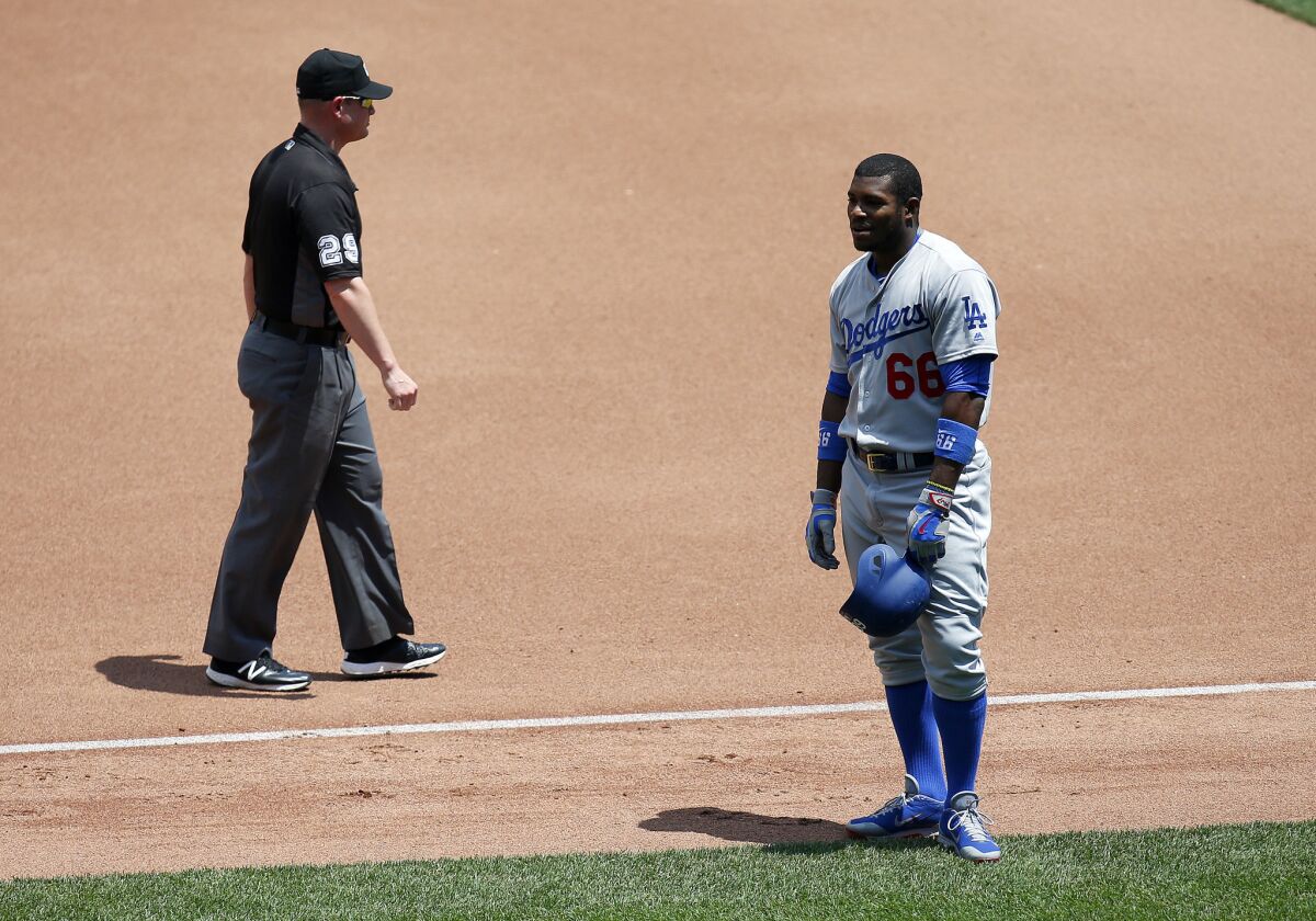 Dodgers outfielder Yasiel Puig (66) reacts after being called out at first base against the Pittsburgh Pirates on June 27.