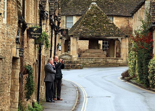 Tourists take photos outside the Unicorn Lodge.