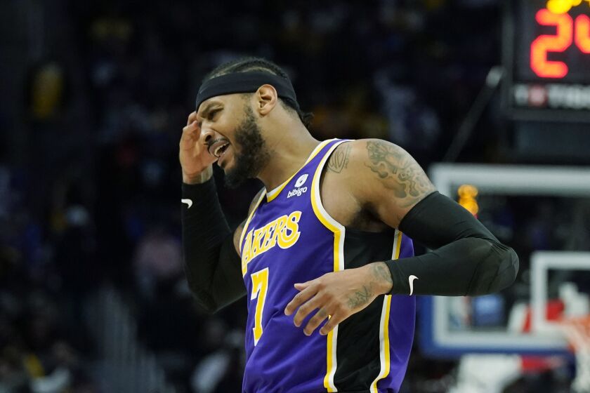 Los Angeles Lakers forward Carmelo Anthony reacts towards the crowd after a basket during the second half of an NBA basketball game against the Detroit Pistons, Sunday, Nov. 21, 2021, in Detroit. (AP Photo/Carlos Osorio)