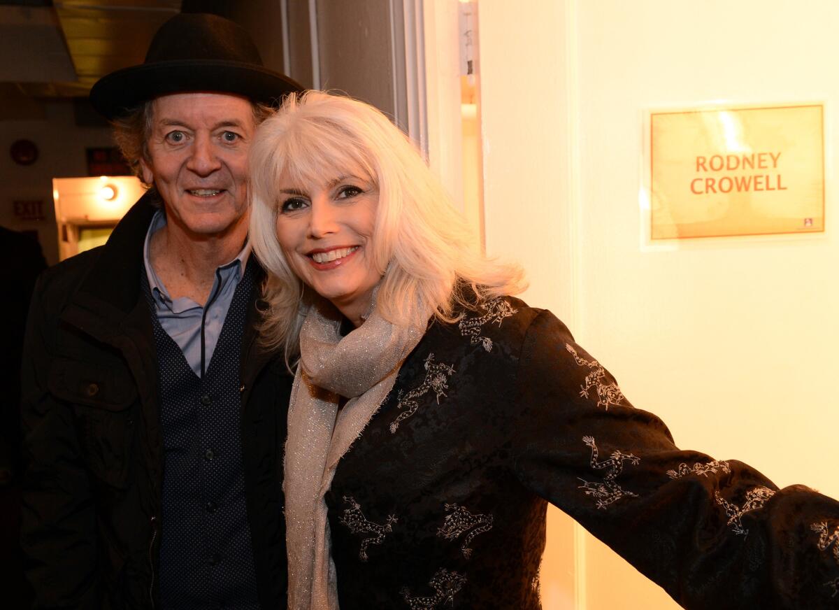 Singer-songwriters Rodney Crowell and Emmylou Harris, shown backstage in February at the Grammy Awards, will play Sunday, June 23, at the Hollywood Bowl.