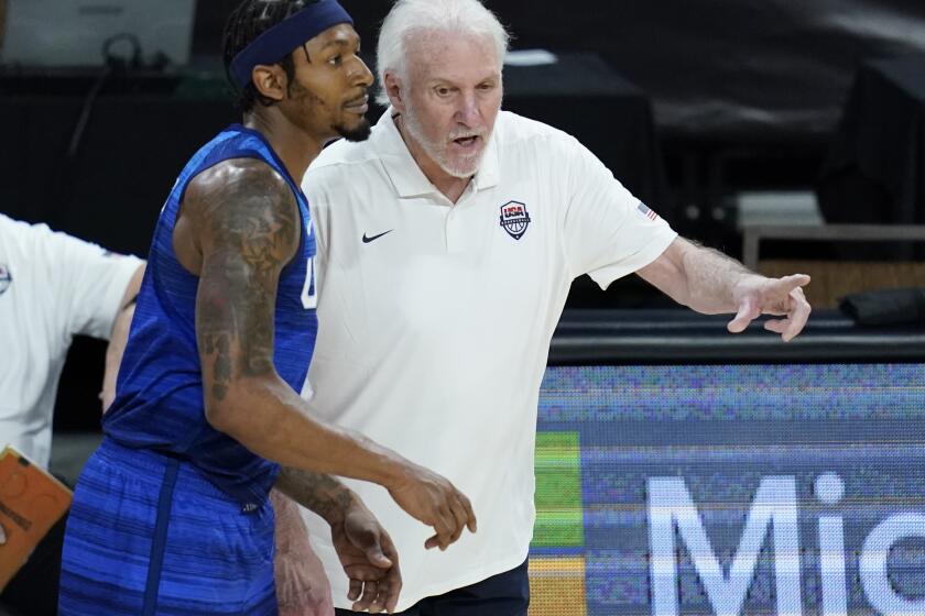 United States' head coach Gregg Popovich speaks with Bradley Beal during an exhibition basketball game against Australia, Monday, July 12, 2021, in Las Vegas. (AP Photo/John Locher)