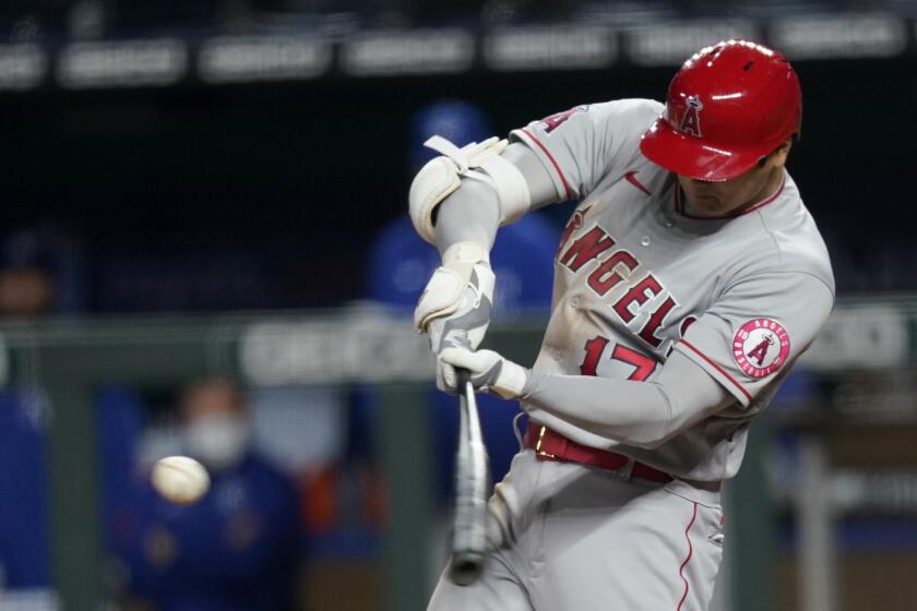 Los Angeles Angels designated hitter Shohei Ohtani hits a two-run double during the seventh inning of a baseball game against the Kansas City Royals at Kauffman Stadium in Kansas City, Mo., Monday, April 12, 2021. (AP Photo/Orlin Wagner)