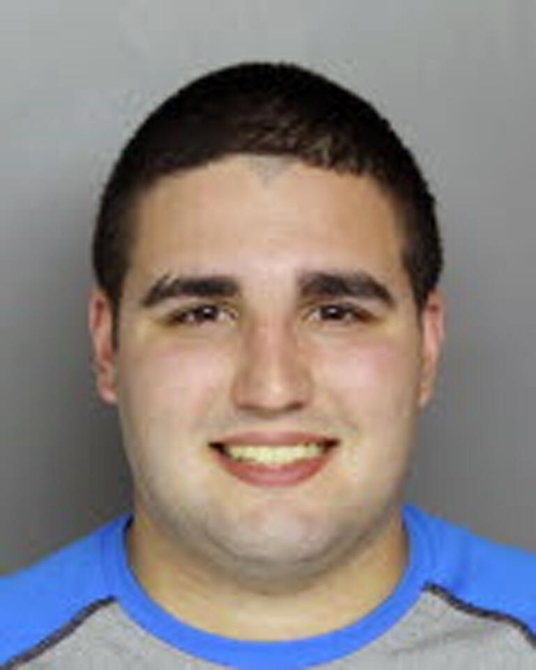 Cosmo Dinardo, 20, of Bensalem, Bucks County is charged with illegal possession of a firearm in Bucks County Monday. His parents own the Solebury property police searched for four missing men.