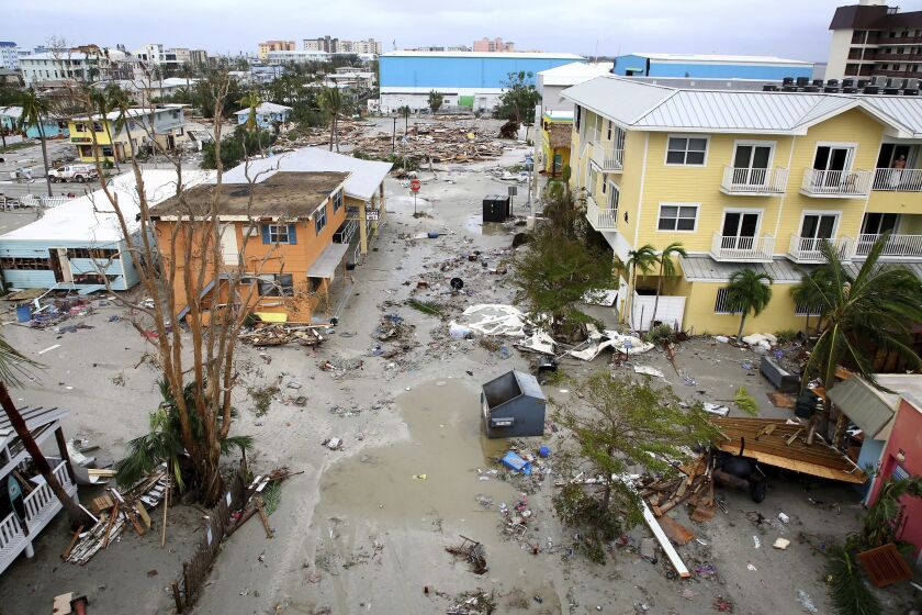 Damaged homes and businesses are seen in Fort Myers Beach, Fla., on Thursday, Sep 29, 2022, following Hurricane Ian. (Douglas R. Clifford/Tampa Bay Times via AP)