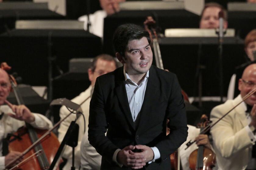 HOLLYWOOD, CA. JUL. 15, 2014. Uzbeck pianist, Behzod Abduraimov acknowledging the applause after the performance of Tchaikovsky's First Piano Concerto at the Hollywood Bowl in Hollywood on Jul. 15, 2014. The program includes Uzbeck pianist, Behzod Abduraimov, in Tchaikovsky's First Piano Concerto and Prokofiev's Romeo and Juliet Suite.(Lawrence K. Ho/Los Angeles Times)