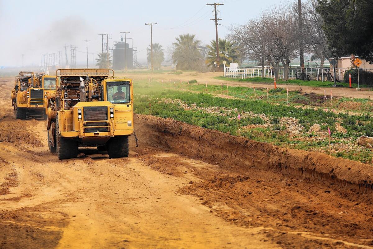 A 953-acre field once used to grow bell peppers, carrots and alfalfa is prepared for the construction of Goassamer Grove, a 3,432-home development north of Bakersfield, Calif.