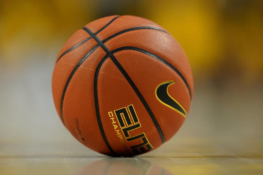 A basketball sits on the court during the second half of an NCAA college basketball game.