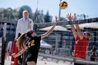 Mira Costa’s Audrey Flanagan, left, tries to loft the ball over Redondo Union’s Victoria Henkel.